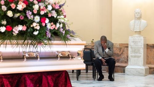 Robin Donaldson mourns his friend Christine King Farris, Martin Luther King Jr.’s sister, at the rotunda of the Capitol in Atlanta on Friday, July 14, 2023. Donaldson and Farris attended Ebenezer Baptist Church together. (Arvin Temkar / arvin.temkar@ajc.com)