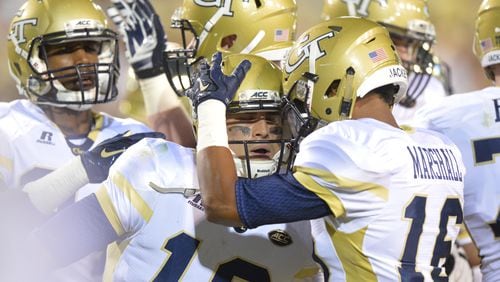 Georgia Tech quarterback Tim Byerly (18) and teammates celebrate after he scored a touchdown in the first half of the Tech season opener at Bobby Dodd Stadium on Thursday, September 3, 2015. HYOSUB SHIN / HSHIN@AJC.COM