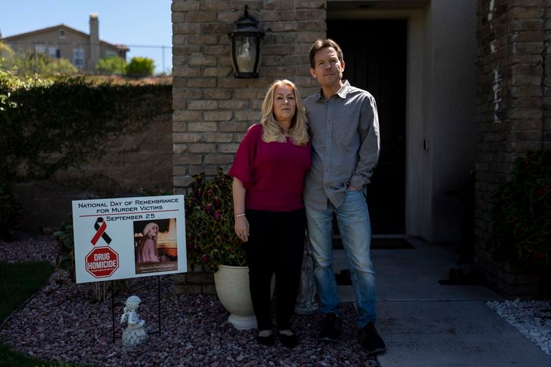 Matt Capelouto and his wife, Christine, whose daughter, Alexandra, died from a fentanyl overdose, stand for a photo outside their home in Temecula, Calif., Tuesday, Sept. 17, 2024. (AP Photo/Jae C. Hong)