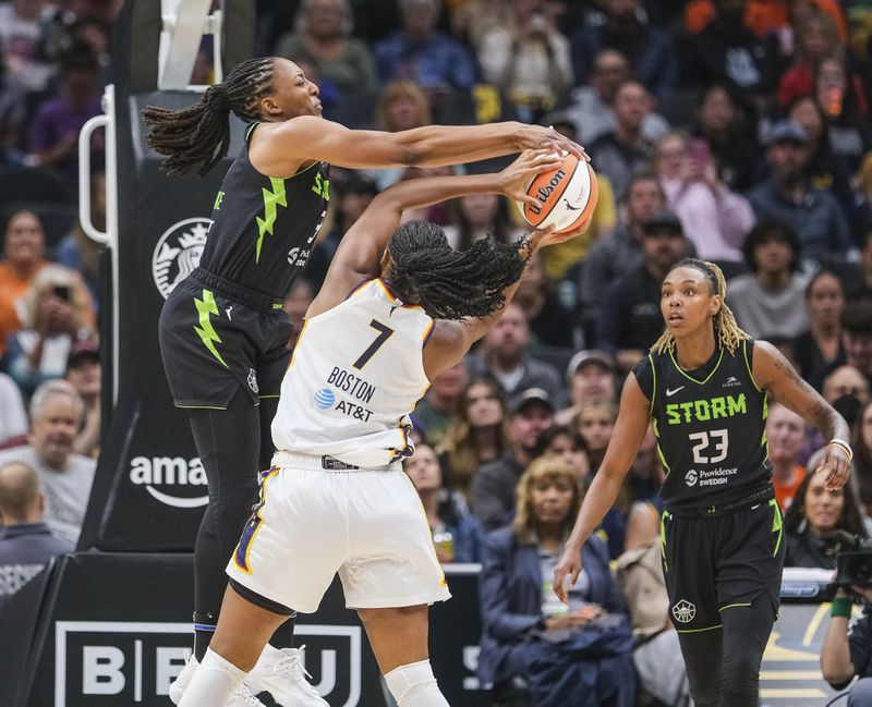Seattle Storm's Nneka Ogwumike gets two hands on the ball while defending against Indiana Fever's Aliyah Boston in the paint, but Boston ended up scoring during the first half of a WNBA basketball game Thursday, June 27, 2024, in Seattle. (Dean Rutz/The Seattle Times via AP)