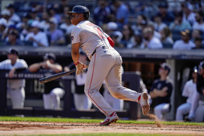 Boston Red Sox's Rafael Devers runs to first base for a two-run single during the fifth inning of a baseball game against the New York Yankees, Saturday, Sept. 14, 2024, in New York. (AP Photo/Frank Franklin II)