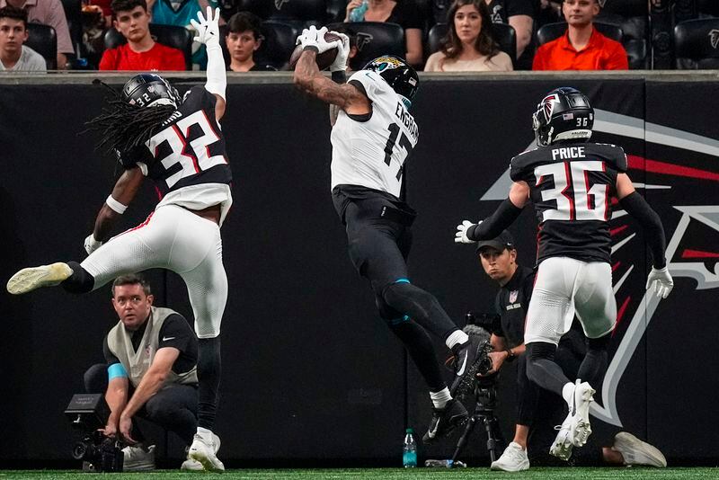 Jacksonville Jaguars tight end Evan Engram (17) makes a touchdown catch against Atlanta Falcons cornerback Kevin King (32) in the first half of an NFL preseason footballl game, Friday, Aug. 23, 2024, in Atlanta. (AP Photo/John Bazemore)