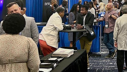 Panelists, recruiters and attendees, network and discuss changes in the industry among other media professionals at the Hilton Chicago, Thursday, August 1, 2024, at the 2024 National Association of Black Journalists convention in Chicago. (AP Photo/Cheyanne Mumphrey)