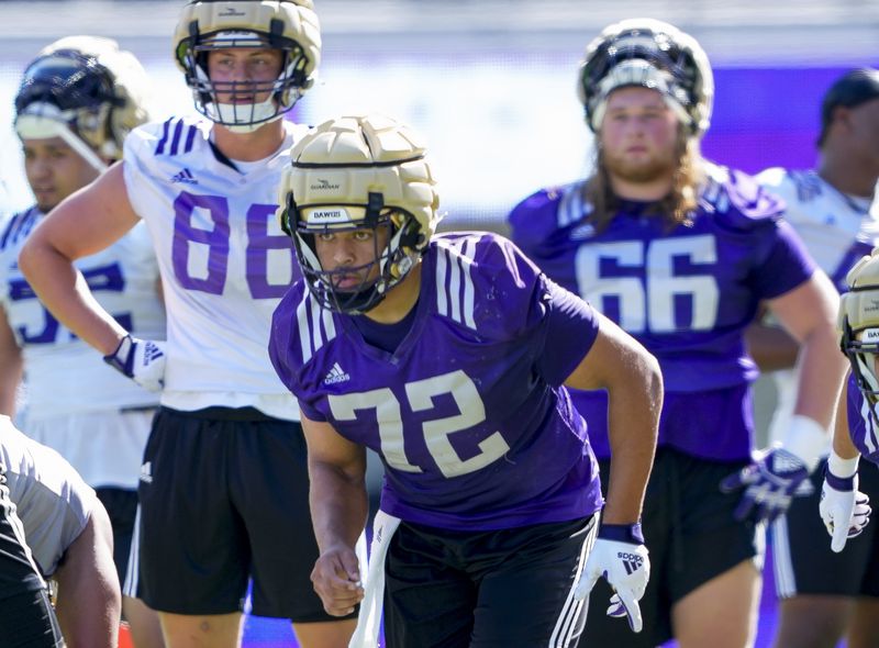 FILE - Washington offensive lineman Parker Brailsford (72) runs a drill during the NCAA college football team's practice, Wednesday, Aug. 2, 2023, in Seattle. (AP Photo/Lindsey Wasson, File)