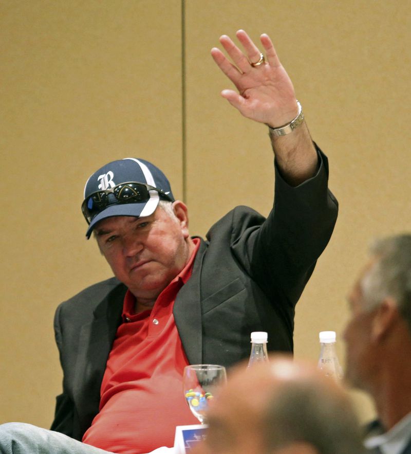 FILE - Inductee Tommy Kramer of Rice waves to the audience as he is introduced during a College Football Hall of Fame news conference in Atlanta on Wednesday, Aug. 28, 2013. (Jason Getz/Atlanta Journal-Constitution via AP, File)