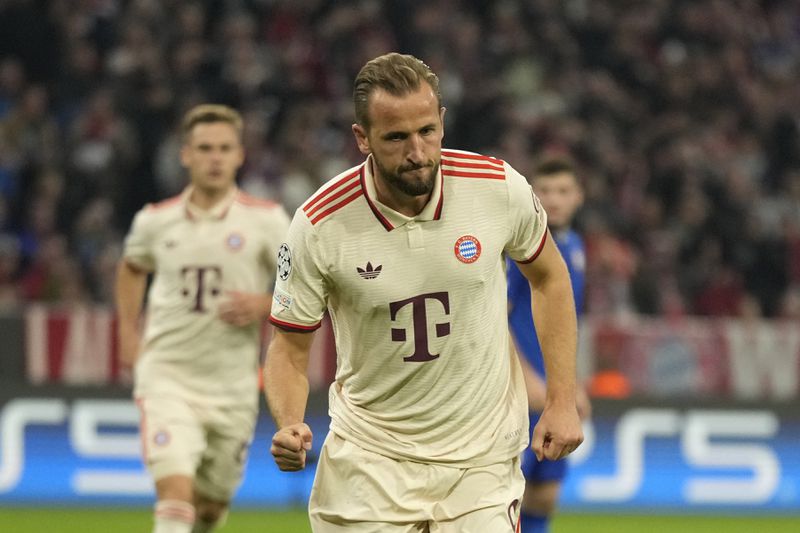 Bayern's Harry Kane celebrates after scoring the opening goal from the penalty sport during the Champions League opening phase soccer match between Bayern Munich and GNK Dinamo at the Allianz Arena in Munich, Germany Tuesday, Sept. 17, 2024. (AP Photo/Matthias Schrader)