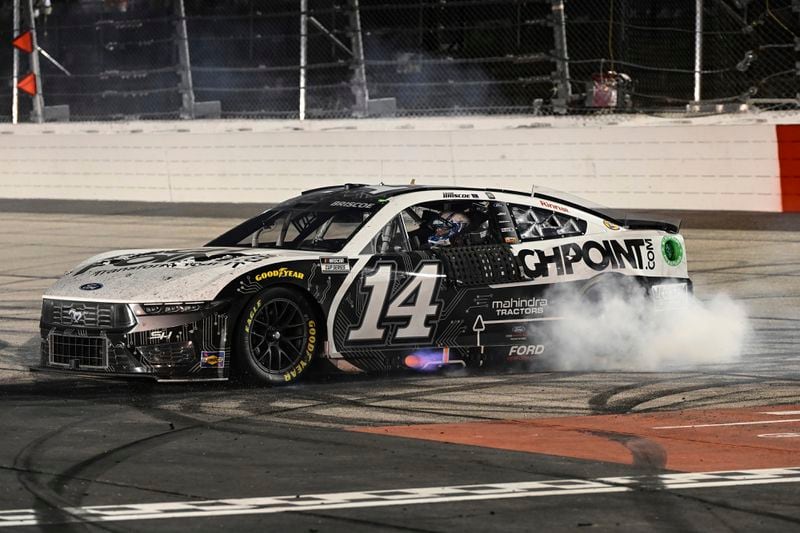 Chase Briscoe does a burnout after winning a NASCAR Cup Series auto race at Darlington Raceway, Sunday, Sept. 1, 2024, in Darlington, S.C. (AP Photo/Matt Kelley)