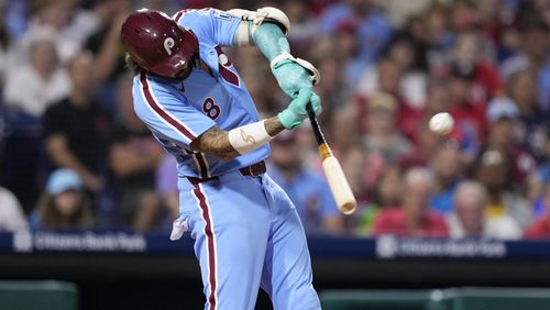 Philadelphia Phillies' Nick Castellanos hits a two-run home run against Atlanta Braves pitcher Grant Holmes during the seventh inning of a baseball game, Thursday, Aug. 29, 2024, in Philadelphia. (AP Photo/Matt Slocum)