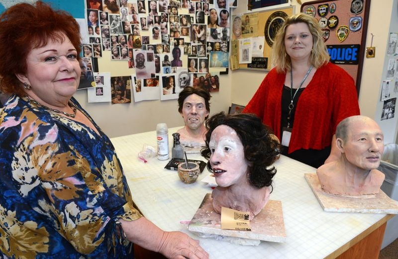 PASSING THE PENCIL--MAY 31, 2013 DECATUR Marla Lawson and her daughter Kelly, are shown in the work area of the GBI sketch lab Friday, May 31, 2013. Like Cher and Madona, Marla Lawson is known in the criminal justice community by just one name: Marla. In the criminal justice world she is a rock star. The self-taught artist has put faces with some of Georgia's infamous and not-so-infamous crimes. She has used clay to reconstruct human remains in the hopes family and friends might recognize a resemblance to a lost loved-one. Her sketch of Olympic Park bomber Eric Robert Rudolph could not have been more exact if he sat for the drawing. She once produced a sketch of an armed robbery suspect even though she only a portion of his face as a basis. But now she is retiring. Again. This time it may be permanent as she is training her daughter, Kelly Lawson, to take her place at the Georgia Bureau of Investigation. KENT D. JOHNSON / KDJOHNSON@AJC.COM