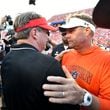 Georgia head coach Kirby Smart and Auburn head coach Hugh Freeze shake hands afterGeorgia beat Auburn in an NCAA football game at Jordan-Hare Stadium, Saturday, September 30, 2023, in Auburn, Alabama. Georgia won 27-20 over Auburn. (Hyosub Shin / Hyosub.Shin@ajc.com)