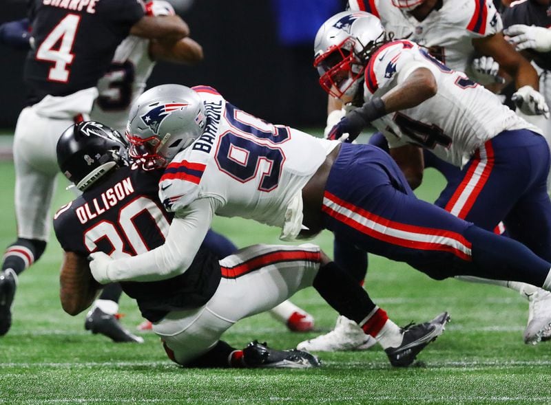 Falcons running back Qadree Ollison is leveled at the line of scrimmage by Patriots defensive lineman Christian Barmore during the second half in a NFL football game on Thursday, Nov. 18, 2021, in Atlanta.    “Curtis Compton / Curtis.Compton@ajc.com”