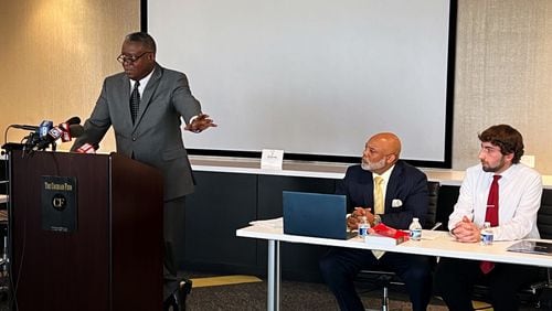 Civil rights attorney Sam Starks (left), criminal defense attorney Torris Butterfield (center) and Tyler Canaris at a news conference announcing their intention to file a civil rights complaint against the Paulding County Sheriff's Office.