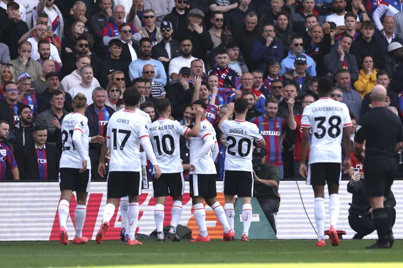 Liverpool's Diogo Jota, second from right, celebrates with teammatesafter scoring the opening goal during the English Premier League soccer match between Crystal Palace and Liverpool at Selhurst Park in London, Saturday, Oct. 5, 2024.(AP Photo/Ian Walton)