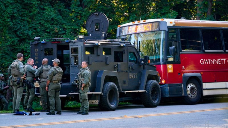 A Dekalb County SWAT vehicle is seen blocking the bus involved in the police chase and hostage situation Tuesday afternoon. July 11, 2024 (Ben Hendren for the Atlanta Journal-Constitution) 