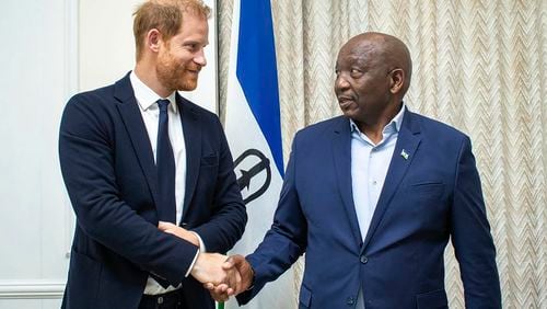 In this photo supplied by the Lesotho Government, Britain's Prince Harry, left, shakes hands with Lesotho's Prime Minister Sam Matekane, on Wednesday, Oct. 2, 2024 while visiting the tiny mountain kingdom where he co-founded a youth-focused charity in 2006 in honour of his late mother, Princess Diana. (Lesotho Government via AP)