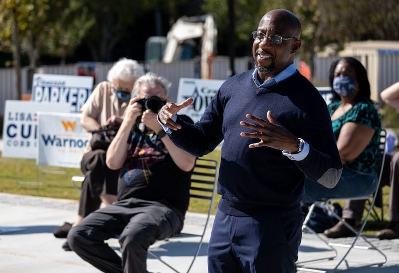 The Rev. Raphael Warnock, a Democrat, was the top vote-getter among 21 candidates in the first round of voting in a special election to the U.S. Senate. He now faces Republican incumbent Kelly Loeffler in a Jan. 5 runoff that could determine control of the chamber. Ben Gray for the Atlanta Journal-Constitution