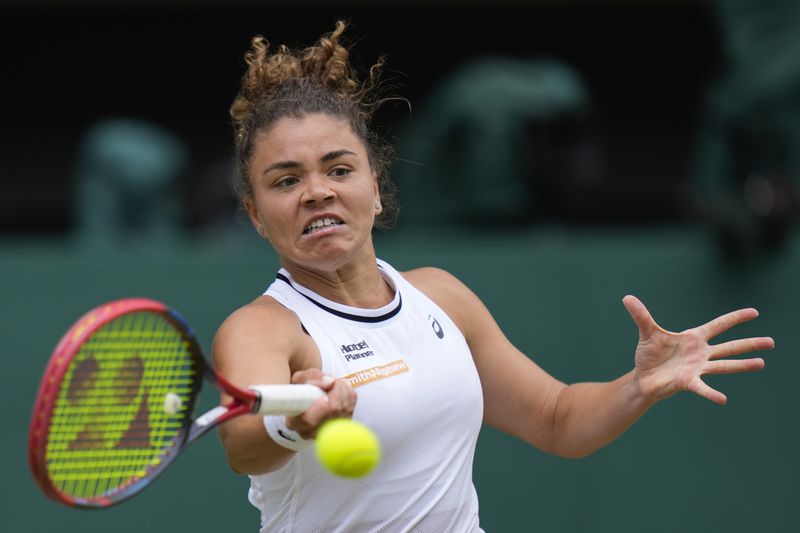 Jasmine Paolini of Italy plays a forehand return to Barbora Krejcikova of the Czech Republic during the women's singles final at the Wimbledon tennis championships in London, Saturday, July 13, 2024. (AP Photo/Alberto Pezzali)