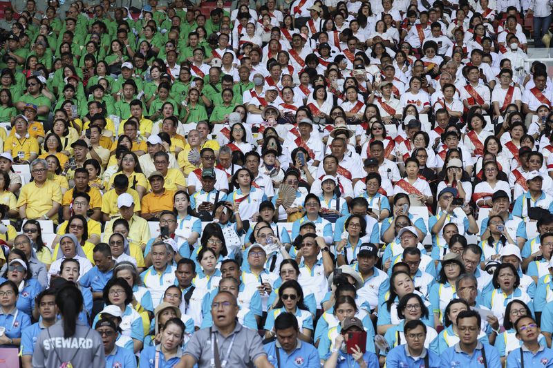 Catholic worshipers attend the holy mass at a Gelora Bung Karno Stadium in Jakarta, Indonesia, Thursday, Sept. 5, 2024, as Pope Francis is visiting the country. (Ajeng Dinar Ulfiana/Pool Photo via AP)