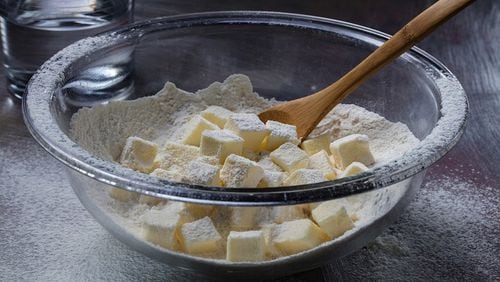 No need to cut the butter into the flour with this method. Instead roughly smash the butter cubes, then stir in water and knead briefly. (Zbigniew Bzdak/Chicago Tribune/TNS)  Joan Moravek / food styling)