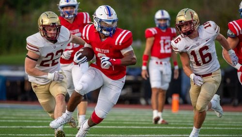 Makari Bodiford, running back for Walton, runs the ball past Brookwood defense during the Walton v Brookwood game on Friday, August 25, 2023. (Jamie Spaar for the Atlanta Journal Constitution)