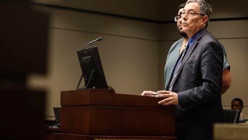 Indigent defense attorney Rob Greenwald stands next to his client during a hearing at Gwinnett County Courthouse on Monday, October 31, 2022. (Natrice Miller/natrice.miller@ajc.com)  