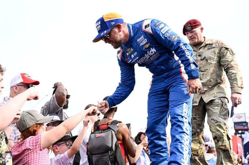 Justin Allgaier greets fans prior to a NASCAR Cup Series auto race at Charlotte Motor Speedway, Sunday, May 26, 2024, in Concord, N.C. (AP Photo/Matt Kelley)
