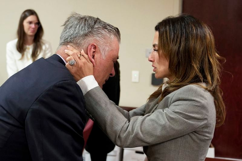 Actor Alec Baldwin, left, and his wife Hilaria embrace after a judge threw out the involuntary manslaughter case for the 2021 fatal shooting of cinematographer Halyna Hutchins during filming of the Western movie "Rust," Friday, July 12, 2024, in Santa Fe, N.M. (Ramsay de Give/Pool Photo via AP)