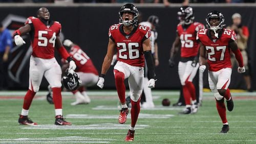 Falcons cornerback (26) Isaiah Oliver, center, leads the celebration after he tackled Philadelphia Eagles tight end Zach Ertz just short of the first down on a fourth down attempt with less than a minute to play to take over on downs and hold on to a 24-20 victory Sunday, Sept. 15, 2019, in Atlanta. (Curtis Compton/Atlanta Journal-Constitution/TNS)