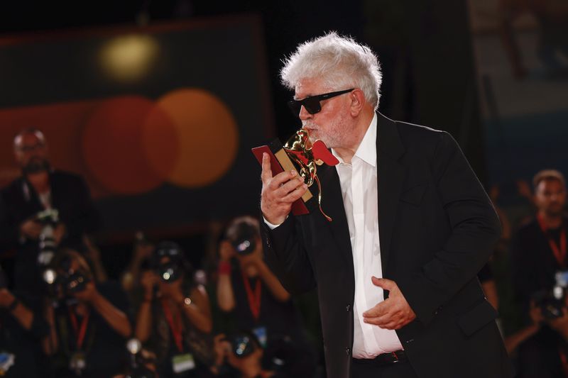 Pedro Almodovar, winner of the golden lion for best film for 'The Room Next Door', poses for photographers at the awards photo call during the closing ceremony of the 81st edition of the Venice Film Festival in Venice, Italy, on Saturday, Sept. 7, 2024. (Photo by Vianney Le Caer/Invision/AP)