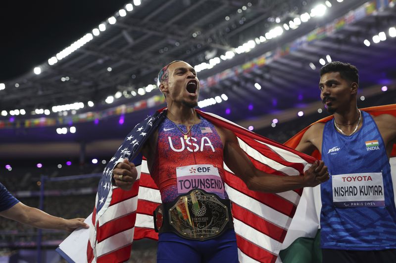 Roderick Townsend celebrates after winning in the T47 Men's High Jump at the 2024 Paralympics, Sunday, Sept. 1, 2024 in Paris, France. (AP Photo/Caleb Craig)