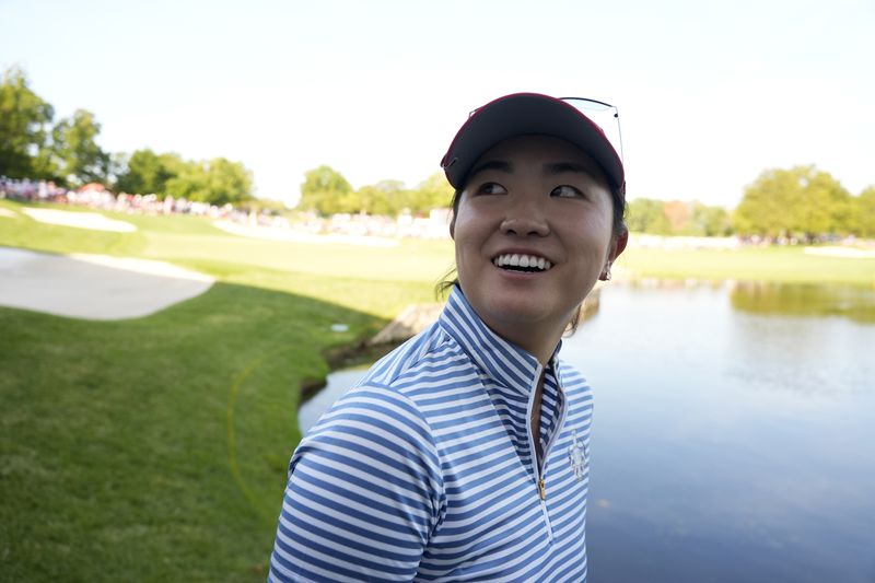 United States' Rose Zhang smiles after winning a fourball match on the 14th hole during a Solheim Cup golf tournament at Robert Trent Jones Golf Club, Saturday, Sept. 14, 2024, in Gainesville, Va. (AP Photo/Chris Szagola)