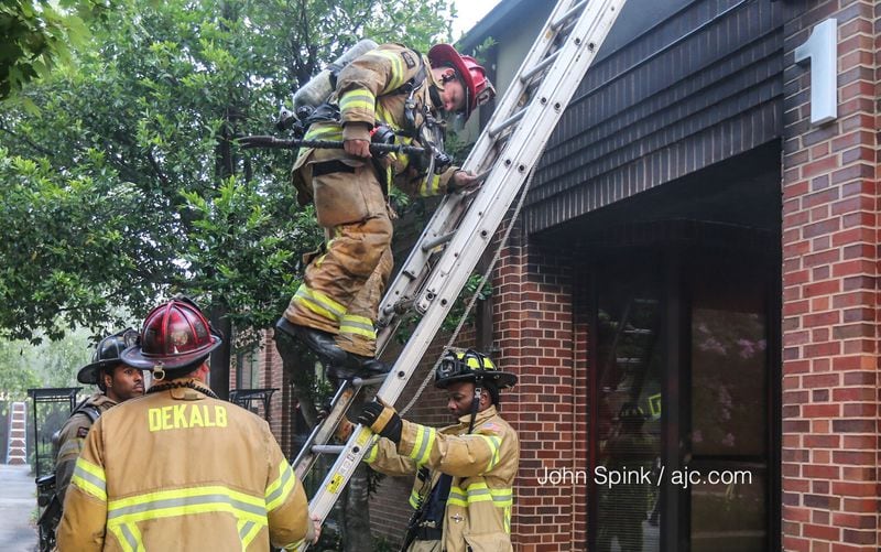 Crews fought a blaze that damaged St. Martin's Episcopal School. JOHN SPINK / JSPINK@AJC.COM