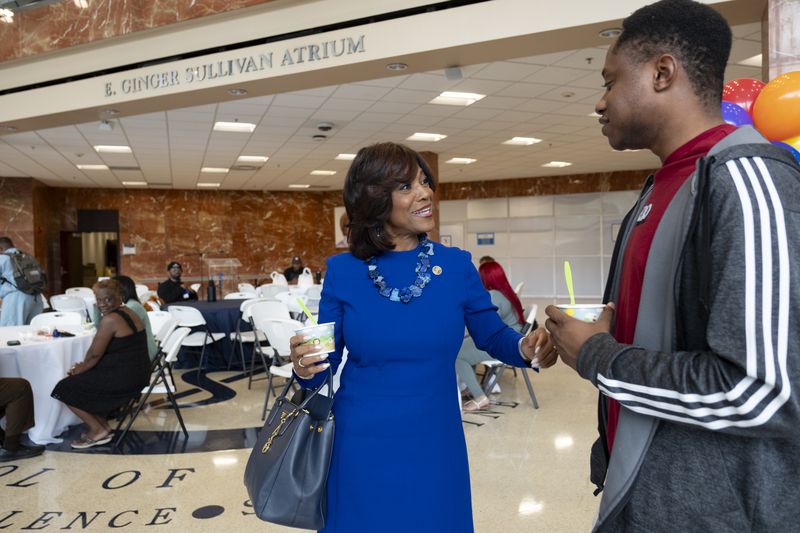 Dr. Valerie Montgomery Rice, president and CEO of the Morehouse School of Medicine, talks with first year medical student Justin Barthel on the first day of classes. (Ben Gray / Ben@BenGray.com)