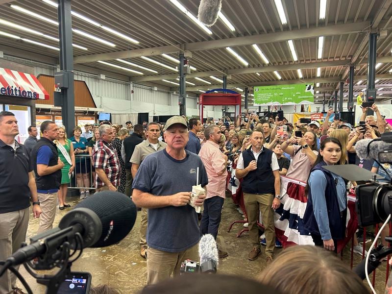 Democratic vice presidential candidate Minnesota Gov. Tim Walz speaks to a crowd gathered at the Dairy building during his visit at the Minnesota State Fair in St. Paul, Minn., Sunday, Sept. 1, 2024. (Clay Masters/Minnesota Public Radio via AP)