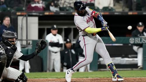 Atlanta Braves' Marcell Ozuna hits a solo home run during the ninth inning of a baseball game against the Chicago White Sox in Chicago, Tuesday, April 2, 2024. (AP Photo/Nam Y. Huh)