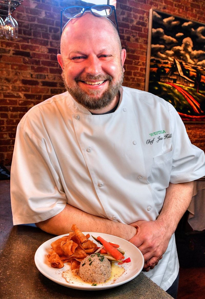 Wisteria chef and owner Jason Hill is proud of his Black-Eyed Pea Hummus & House Pickle Plate. STYLING BY JASON HILL / CONTRIBUTED BY CHRIS HUNT PHOTOGRAPHY