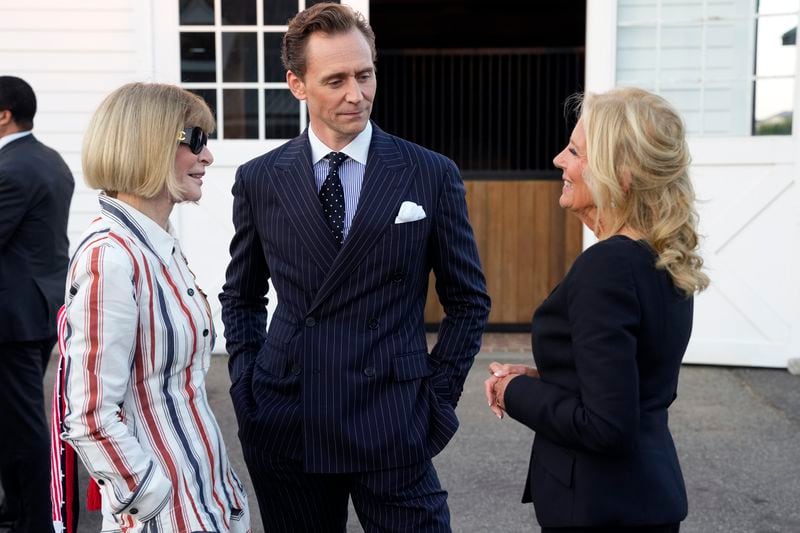 Anna Wintour, from left, Tom Hiddleston and First Lady of the United States, Dr. Jill Biden attend the Ralph Lauren Spring/Summer 2025 fashion show as part of New York Fashion Week on Thursday, Sept. 5, 2024, at Khalily Stables in Bridgehampton, N.Y. (Photo by Charles Sykes/Invision/AP)