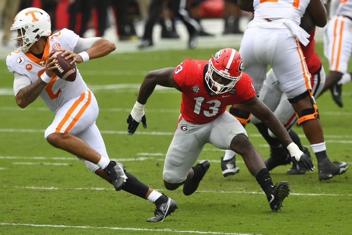 Georgia linebacker Azeez Ojulari (13) chases Tennessee quarterback Jarrett Guarantano (2) during the first half of a football game Saturday, Oct. 10, 2020, at Sanford Stadium in Athens. JOHN AMIS FOR THE ATLANTA JOURNAL- CONSTITUTION