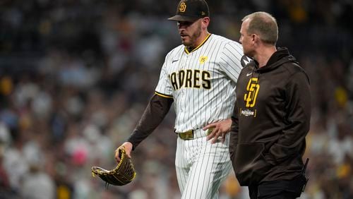 San Diego Padres starting pitcher Joe Musgrove exits the game during the fourth inning in Game 2 of an NL Wild Card Series baseball game against the Atlanta Braves, Wednesday, Oct. 2, 2024, in San Diego. (AP Photo/Gregory Bull)