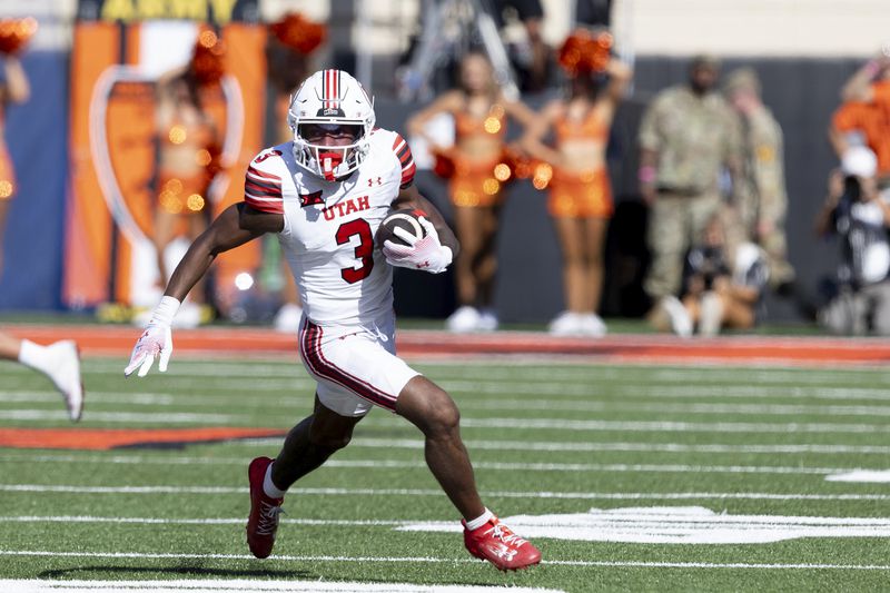 Utah wide receiver Dorian Singer runs with the ball in the first half of an NCAA college football game against Oklahoma State, Saturday, Sept. 21, 2024, in Stillwater, Okla. (AP Photo/Mitch Alcala)