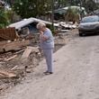 Elsie Hicks looks at the destruction of the home she has loved in for 25 years, in the aftermath of Hurricane Helene, in Horseshoe Beach, Fla., Saturday, Sept. 28, 2024. (AP Photo/Gerald Herbert)