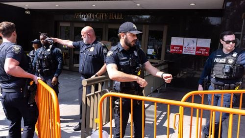 Atlanta police officers set barricades in front of City Hall as council members discussed and voted on legislation to fund construction of a public safety training center in DeKalb County, Georgia, on June 5, 2023. (Arvin Temkar/The Atlanta Journal-Constitution/TNS)