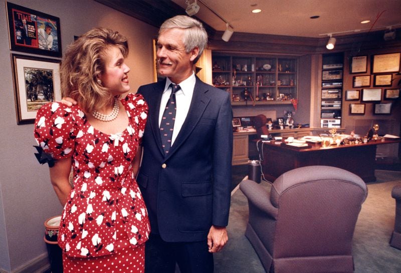 Ted Turner is shown in his office at CNN Center with his daughter Laura on July 7, 1988. (ANDY SHARP/AJC staff)