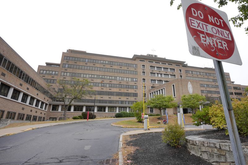 An empty driveway leads to the closed Carney Hospital, Thursday, Sept. 19, 2024, in the Dorchester neighborhood of Boston. (AP Photo/Steven Senne)