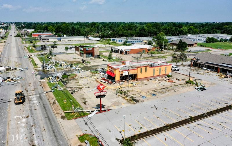 Storm damage is shown, Sunday, May 26, 2024, at a shopping center on West Walnut Avnue in Rogers, Ark. Powerful storms left a wide trail of destruction across Texas, Oklahoma and Arkansas. (Charlie Kaijo/The Northwest Arkansas Democrat-Gazette via AP)