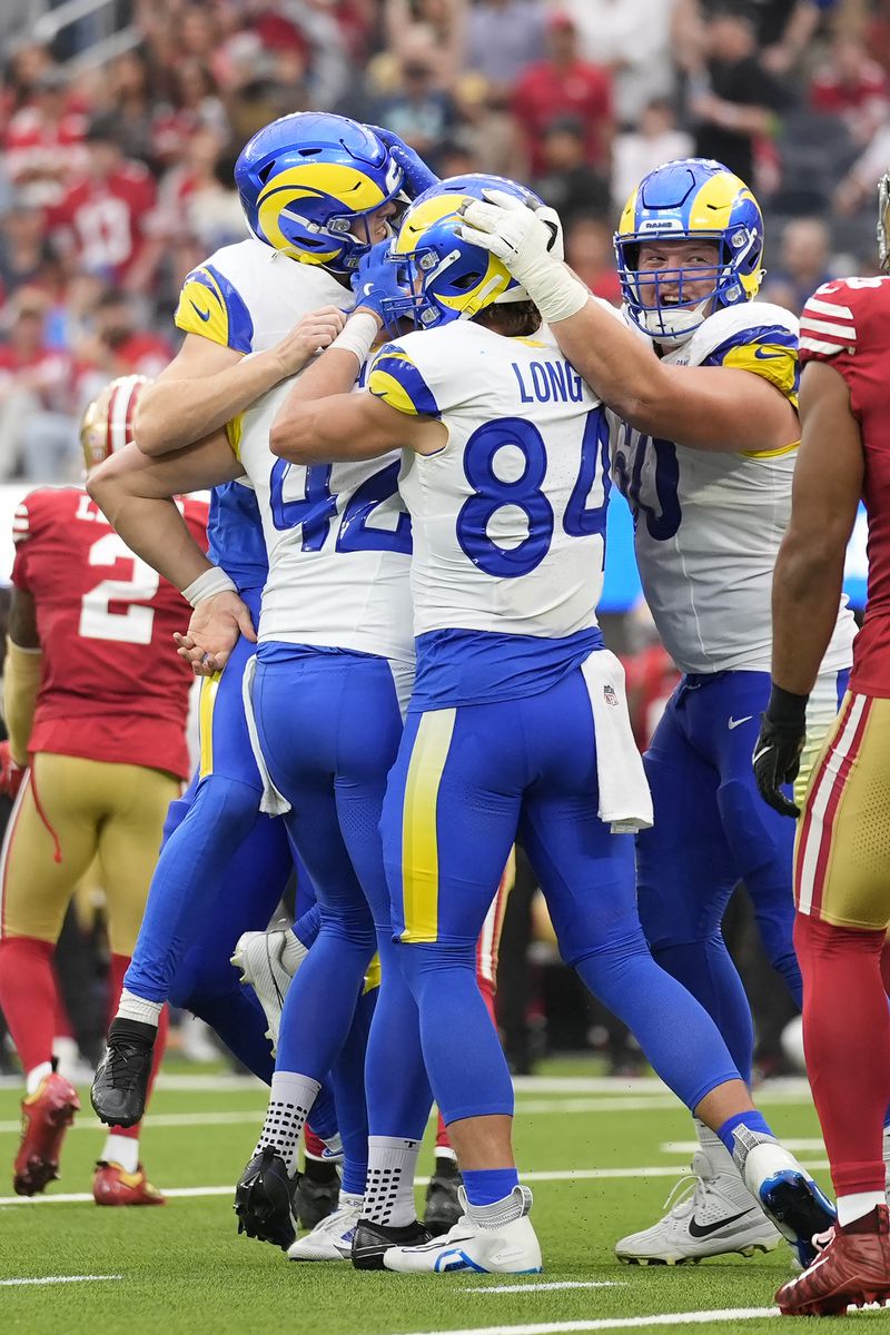 Los Angeles Rams place kicker Joshua Karty, top left, celebrates with teammates after kicking a field goal against the San Francisco 49ers during the second half of an NFL football game, Sunday, Sept. 22, 2024, in Inglewood, Calif. (AP Photo/Ashley Landis)