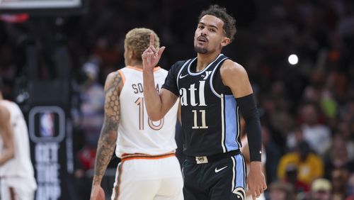 Atlanta Hawks guard Trae Young (11) celebrates a 3-point basket during the first half of their game against the San Antonio Spurs in the Hawks’ annual MLK Day game at State Farm Arena, Monday, January 15, 2024, in Atlanta. (Jason Getz / Jason.Getz@ajc.com)