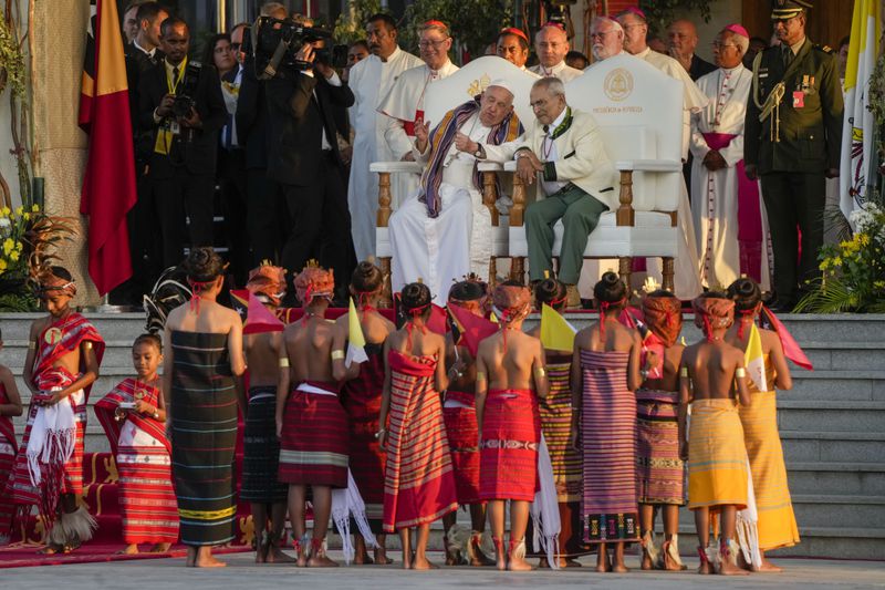 Pope Francis and East Timor's President José Manuel Ramos-Horta, right, sit as they attend a welcome ceremony outside the Presidential Palace in Dili, East Timor, Monday, Sept. 9, 2024. In East Timor Francis had to negotiate perhaps the most sensitive issue clouding the visit to Asia and Oceania: the case of Bishop Carlos Ximenes Belo, the revered national hero who won the Nobel Peace Prize for his nonviolent independence campaign. (AP Photo/Gregorio Borgia)