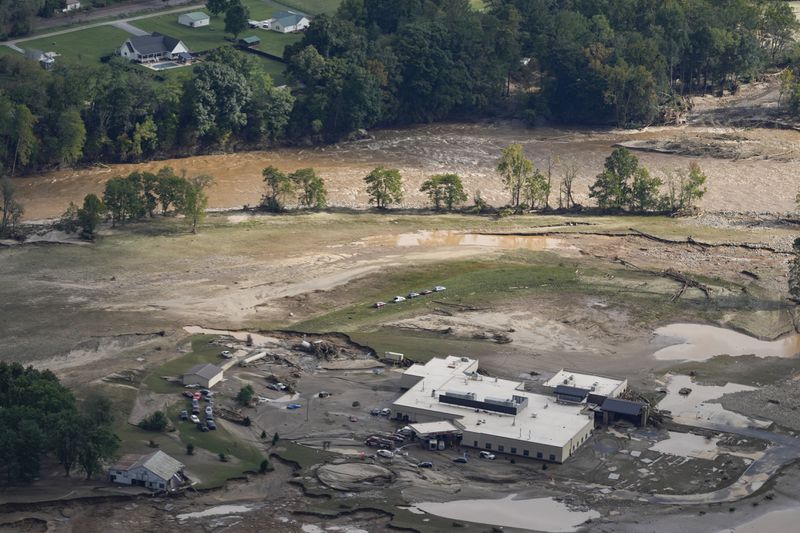 An aerial view of flood-damaged Unicoi County Hospital in the aftermath of Hurricane Helene, Saturday, Sept. 28, 2024, in Erwin, Tenn. (AP Photo/George Walker IV)