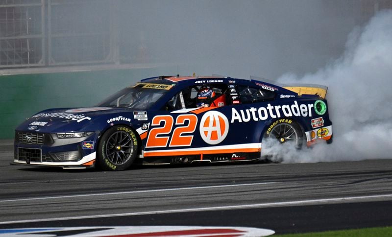 Joey Logano celebrates with a burnout after winning a NASCAR Cup Series auto race at Atlanta Motor Speedway, Sunday, Sept. 8, 2024, in Hampton, Ga. (Hyosub Shin/Atlanta Journal-Constitution via AP)